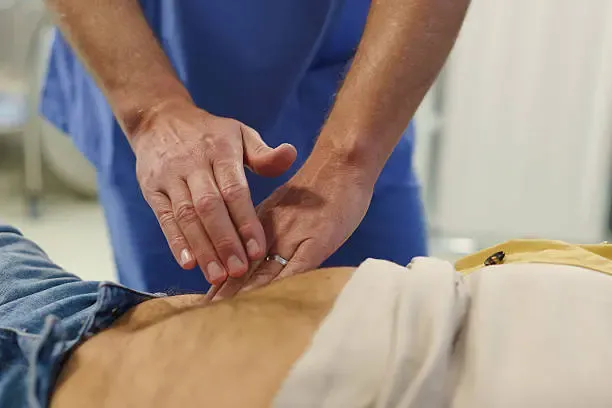 Medical professional assessing jaundice symptoms through examination