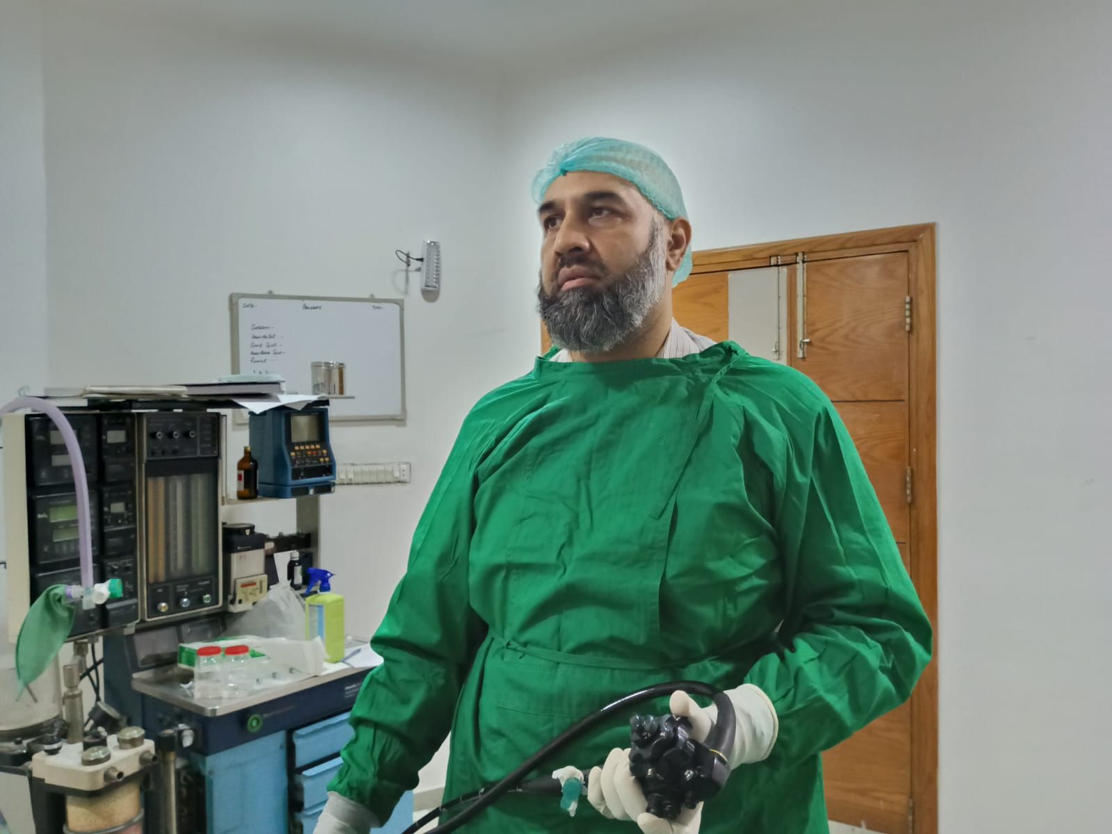 Dr. M. Ali Taj preparing advanced clinical equipment for an EUS procedure
